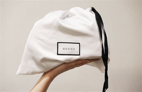 white gucci dust bag.